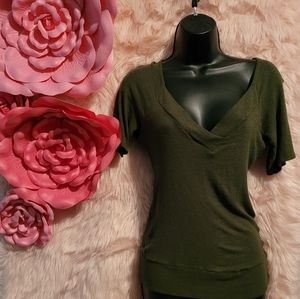 Green V-neck blouse